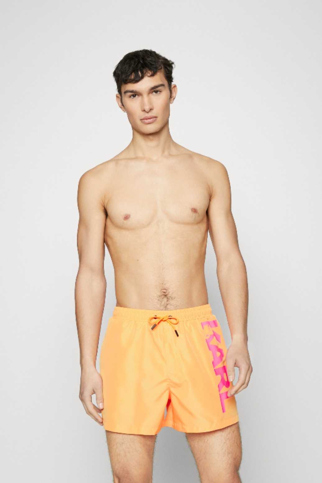 Orange swim trunks with large logo